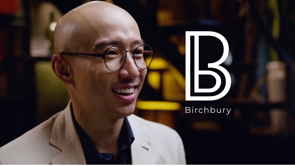 Matt, Birchbury's founder, smiling in an interview setting, with the Birchbury logo
